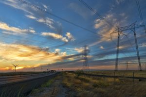 windmills and powerlines working to supply electricty 